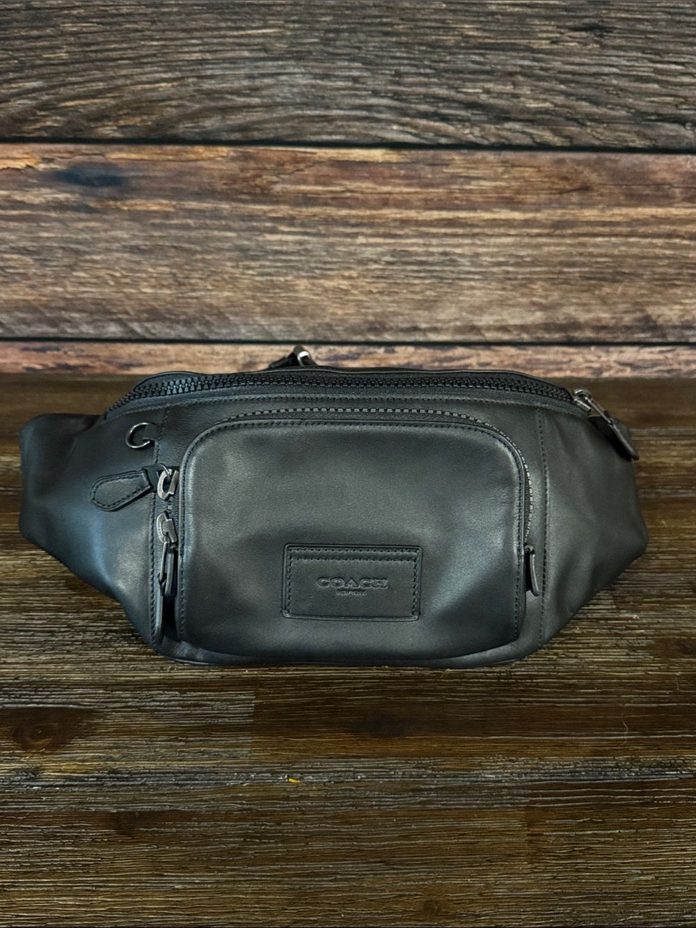 Coach Track Belt Bag in black leather.